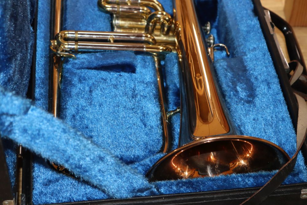 A Yamaha trumpet and a cased camera